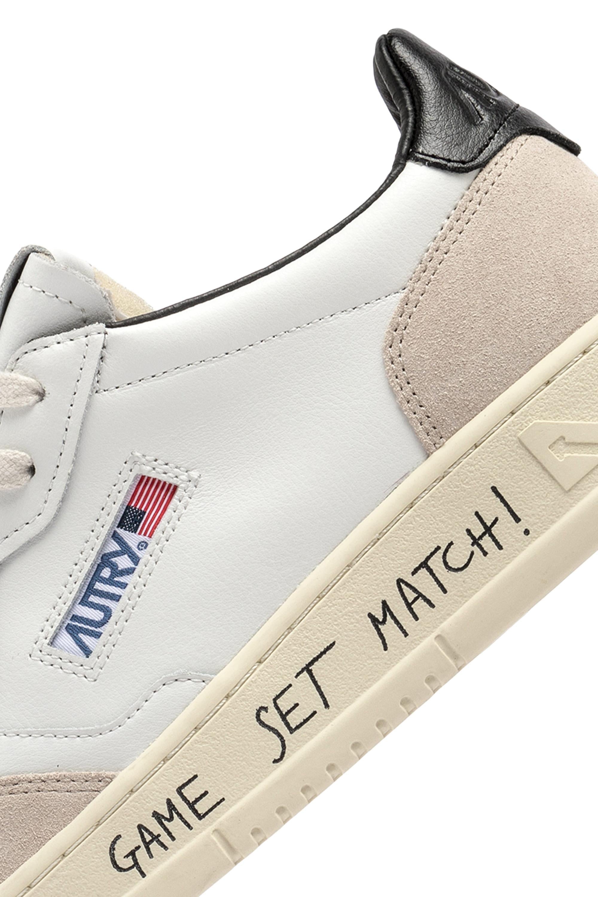 Sneakers pelle et daim avec inscription game set match