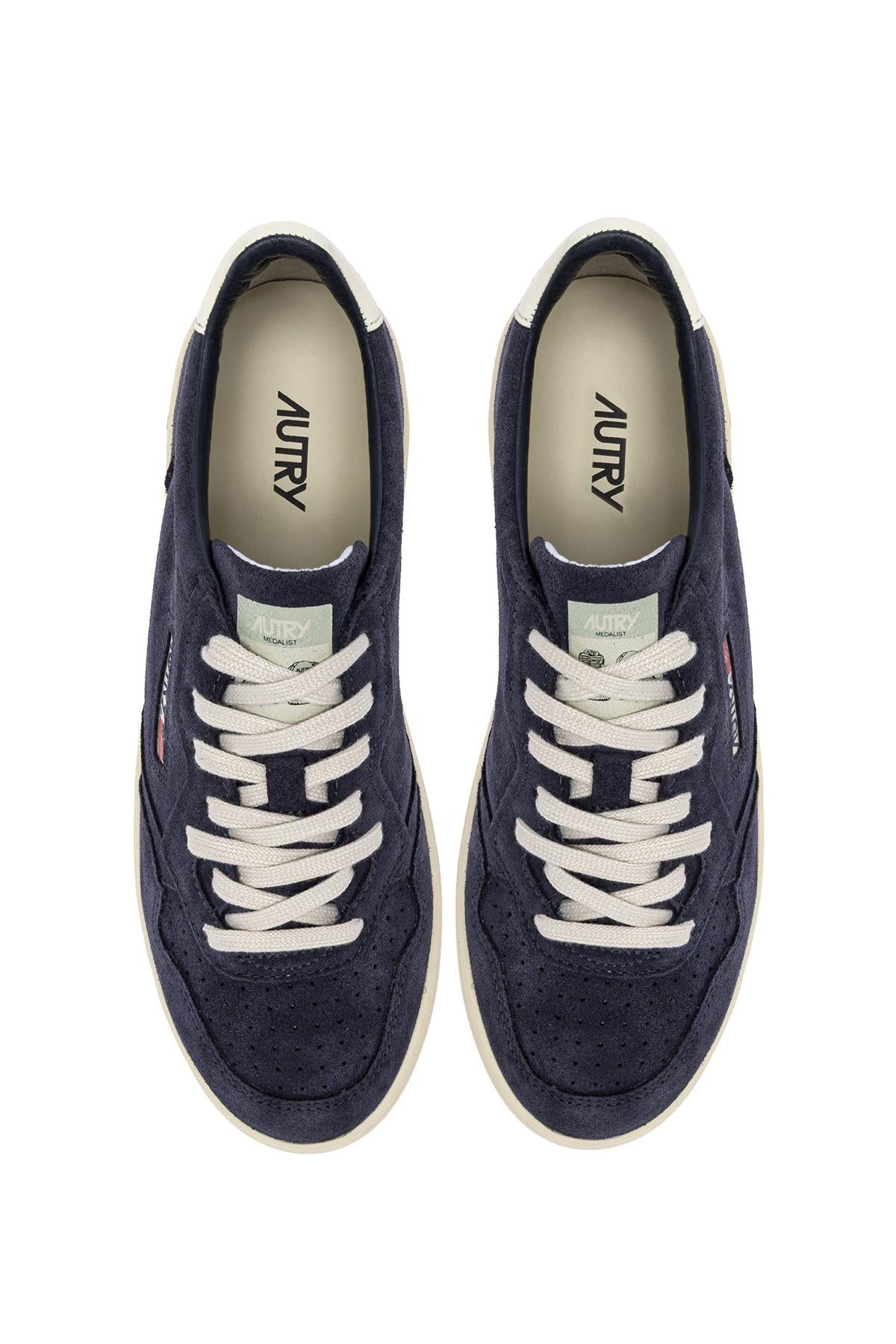 Sneaker medalist en daim contrefort blanc